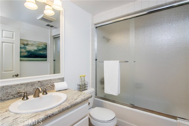 Downstairs full bathroom with tub and shower