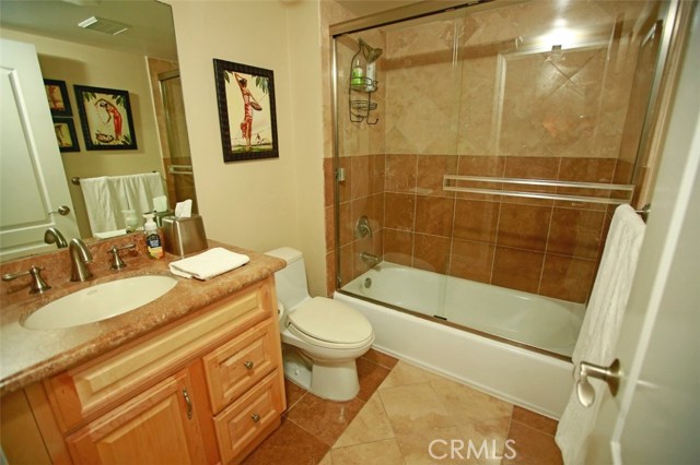 Guest bath with Travertine and tub/shower combo!