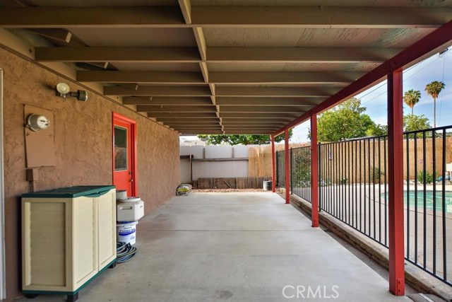 Fully covered patio with pool fence