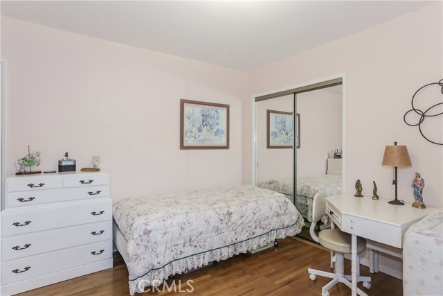 Bedroom with hardwood floors, large closet