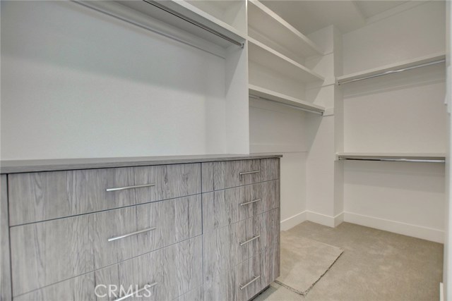 2nd Level . . . Master closet with custom cabinetry