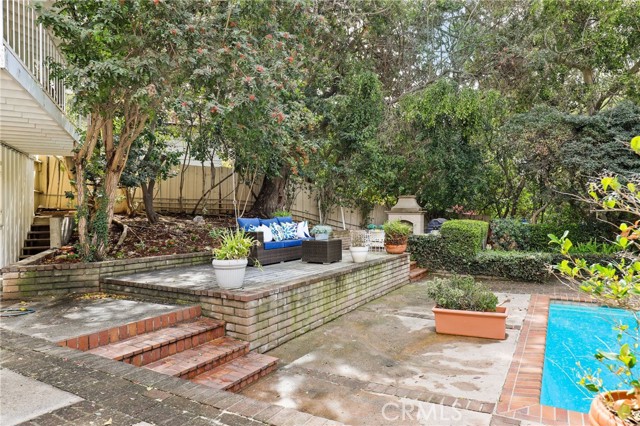 Great shot of the elevated patio with fireplace sitting area in the background.