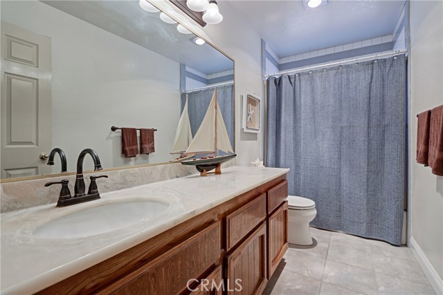 Hallway bathroom downstairs that is shared between bedroom 2 and 3.