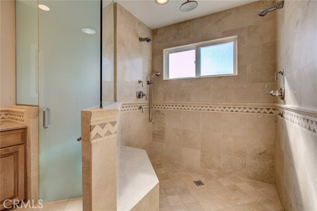 OVERSIZED walk-in shower with TWO shower heads and a RAIN HEAD!