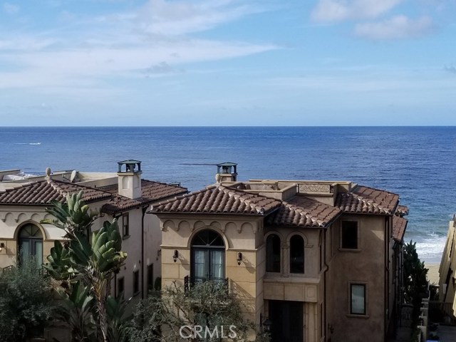 Another Ocean view from the main floor balcony with white water and sand to the right