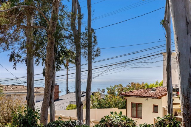 Views of the ocean and sunsets from the living room, dining room, kitchen, office, and backyard and patio.