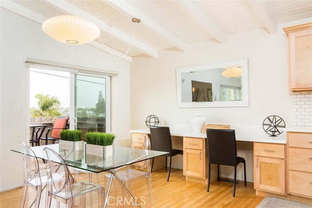 Dining area and two work stations.  Sliding glass door to patio.