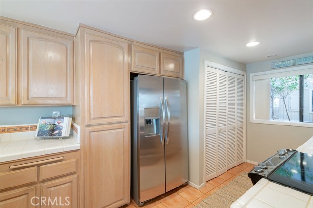 Great kitchen with brand new fridge / laundry behind the louvered doors