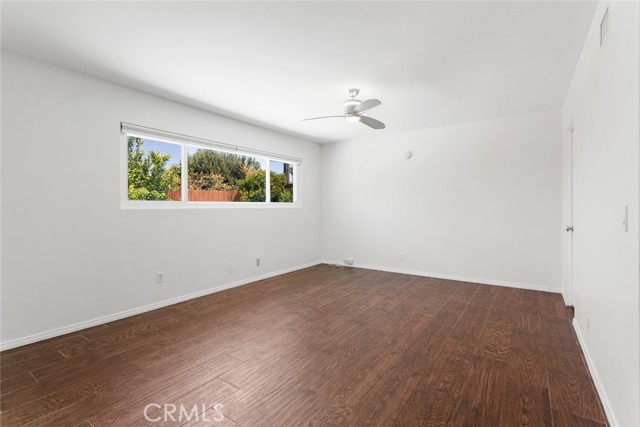 A quick snapshot of the master suite. You can see the mature fruit trees in the window background.  Fan ceilings all throughout the 3 bedrooms.