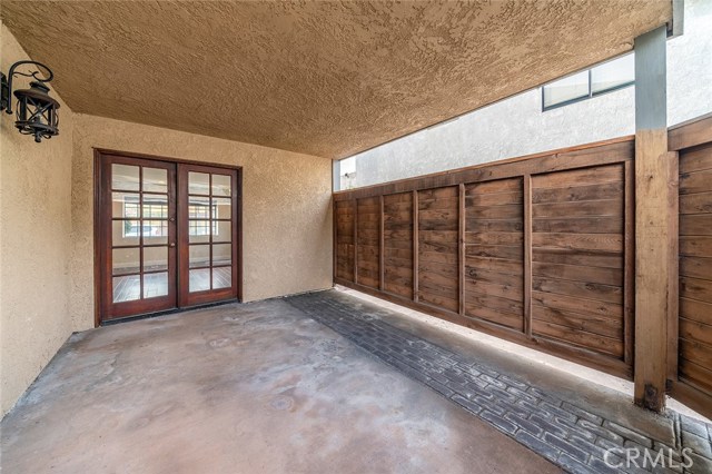 Enclosed, covered, private deck off of the living room is perfect for al fresco dining... outdoor living room... or play area for the kids! Indoor/outdoor living at its finest.