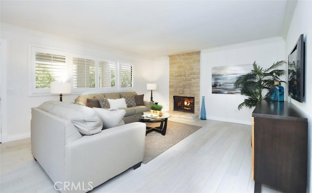 Sharp, sophisticated coastal style in this beautifully upgraded top floor unit.