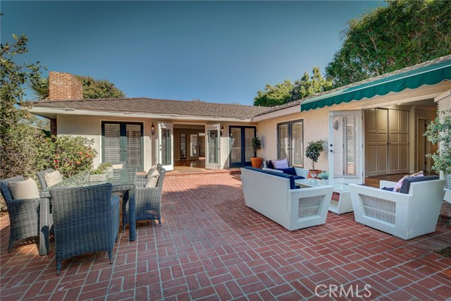 This is a home to cherish! Look at the size of that patio.