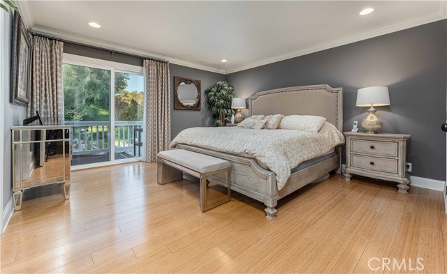 Large Master Bedroom with balcony over looking peaceful backyard