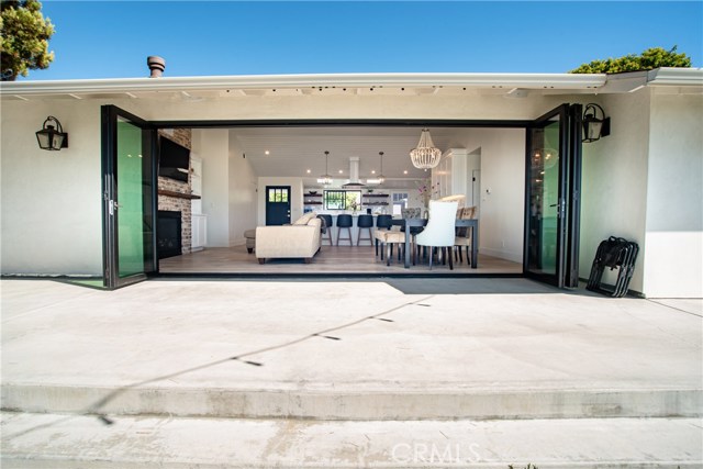 18 foot La Cantina accordion doors opening up to new concrete deck