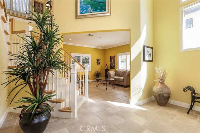 Incredible entry foyer and formal living room with Italian tile flooring