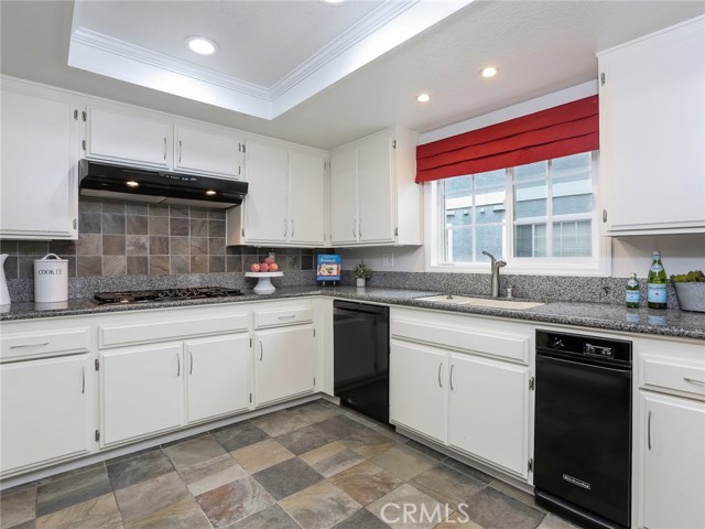 Kitchen with dishwasher and trash compactor