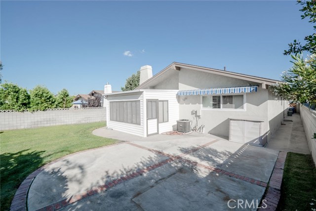 Patio room has a permit and is NOT included in the homes' square footage. The large awning really does help keep the back bedroom cooler.  The sun is intense in this area and would be great for a garden or pool if so desired.