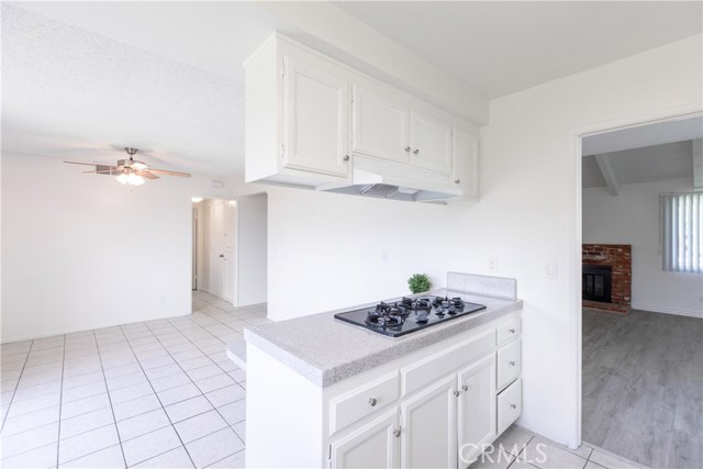 The kitchen leads to dining room
