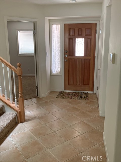 front door entry to hall and 2nd bedroom to left