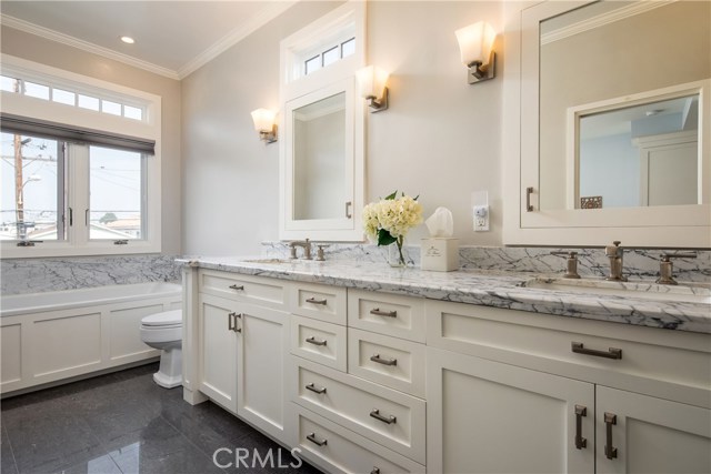 Stunning Master Bathroom featuring double sinks, spa tub and walk-in shower.