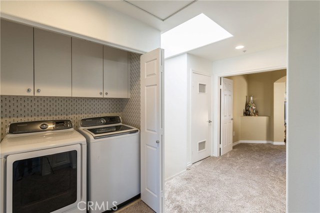 Upstairs Hallway showing Laundry, Skylight, Water Heater Closet & Entrance to Master Suite