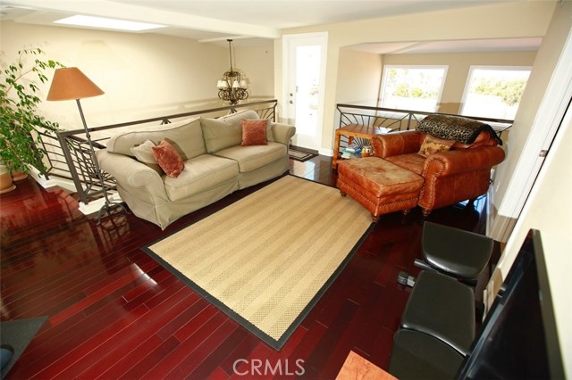 Note the dazzling Rosewood floors in this loft view!