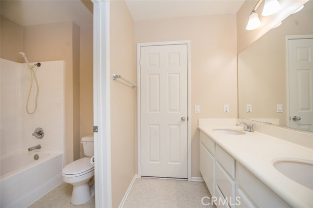 Jack and Jill bathroom, dual sinks and shower in tub