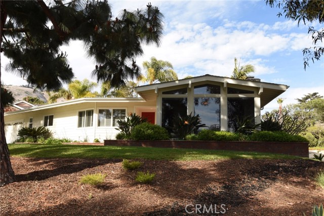 Another view of 32 Packet Road...Pretty red front door invites you into this modern mid-century home