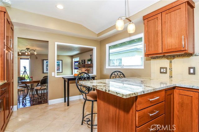 The kitchen has a breakfast bar counter and and open entertaining area.