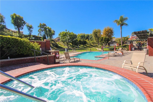 Beautiful community spa/pool surrounded by lush greenbelts, and great picnic area with table and chairs to enjoy a relaxing day at pool with friends/family!