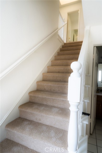 Light and bright stairs with a skylight at the top