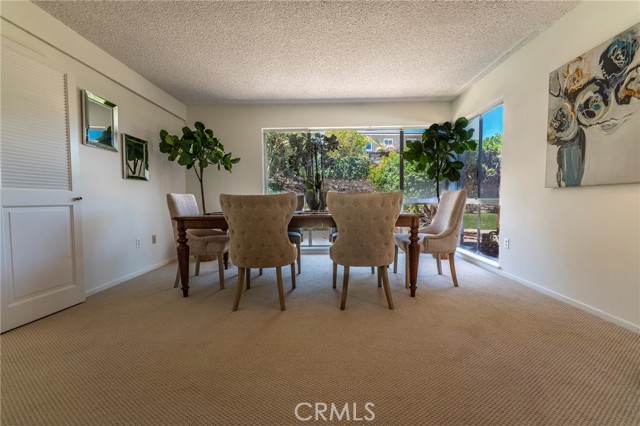 Dining Area off living room; enter kitchen thru doorway to left.