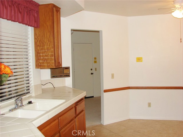 VIEW OF OPENING FROM FORMAL DINING ROOM INTO KITCHEN.