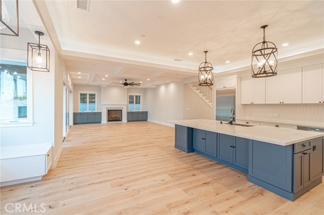 View of kitchen island and family room.