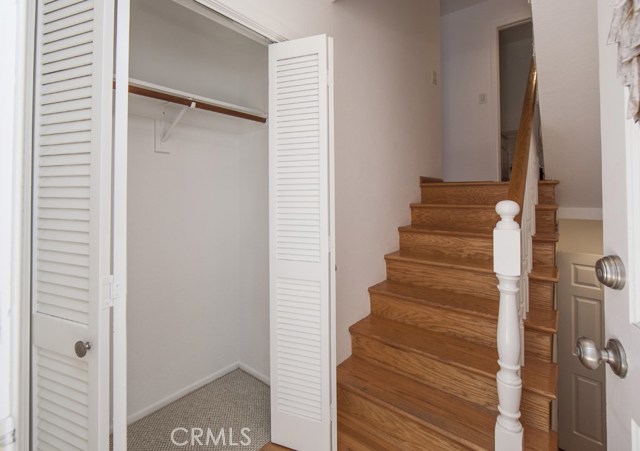 Enter front door to entry with closet and steps leading up and down.