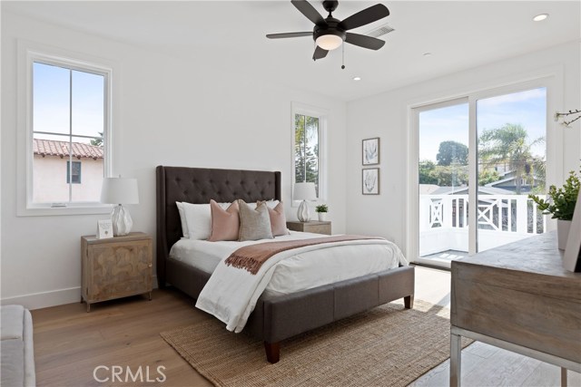 Ensuite bedroom wtih private balcony through the sliding French doors