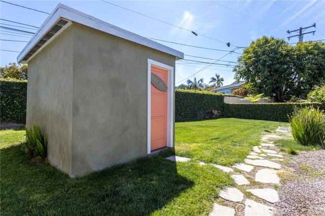 Shed "Surf Shack" for storage in backyard.