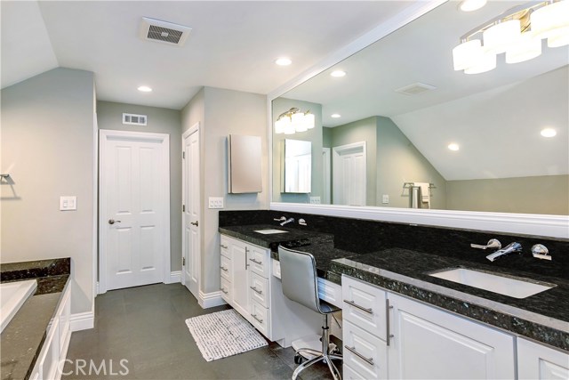 Remodeled Master Suite Bathroom with Dual sinks and Granite counters.