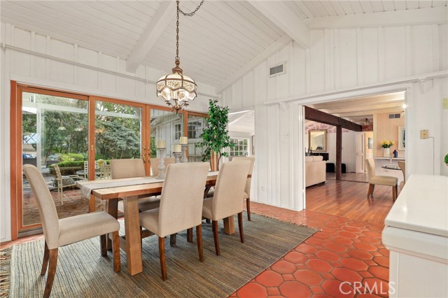 Dining room off of the kitchen looking out into your own personal parkland!