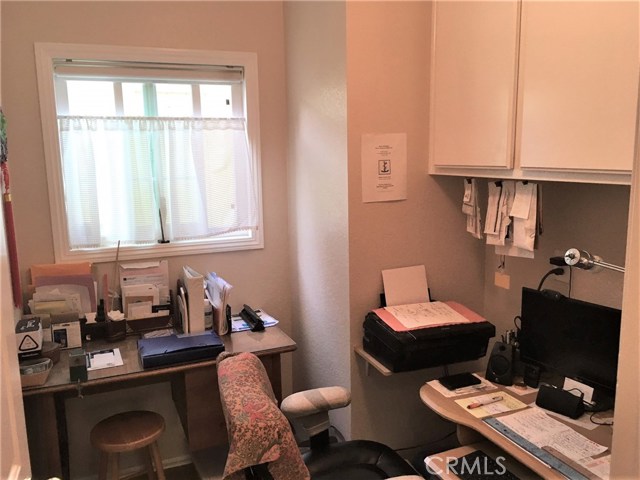 Utility room with washer/dryer hookups converted to small office space