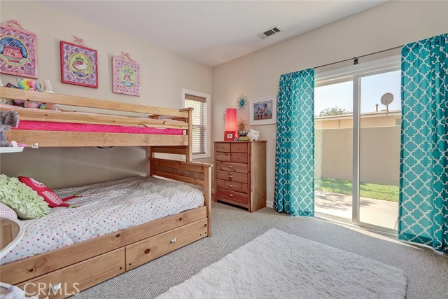 Downstairs guest bedroom with access to backyard.