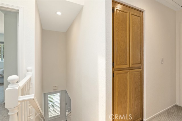 Staircase and upstairs hallway storage.