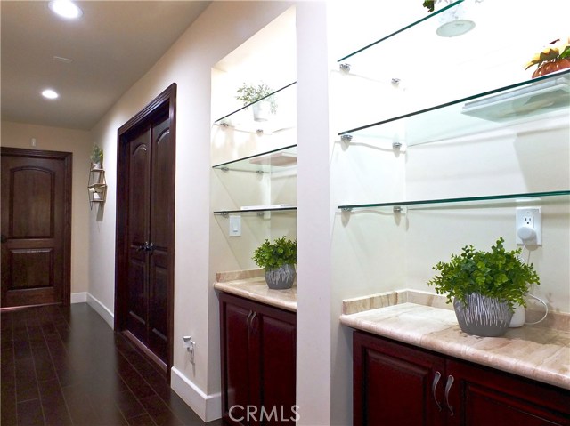 Downstairs hallway. Double doors lead to master bedroom. The far left door leads to an additional bedroom.