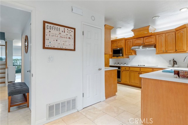 Pantry and kitchen view from breakfast nook.