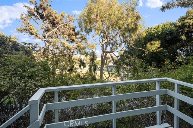 Back unit stairway landing looking east over Live Oak Park.