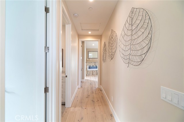 Upstairs Hallway Connecting the Family Room to the Primary Bedroom and Primary Bathroom.