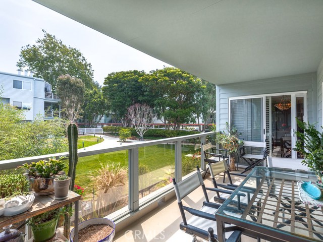 Another view of the patio overlooking the courtyard area.  The slider doors visible in photo lead into the living/dining room.
