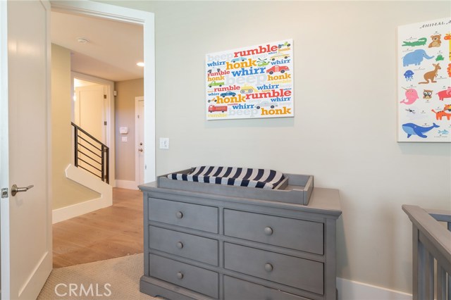 Bedroom #1 on the first level with high ceilings and abundant storage