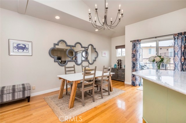 Dining area with a second balcony off the kitchen.