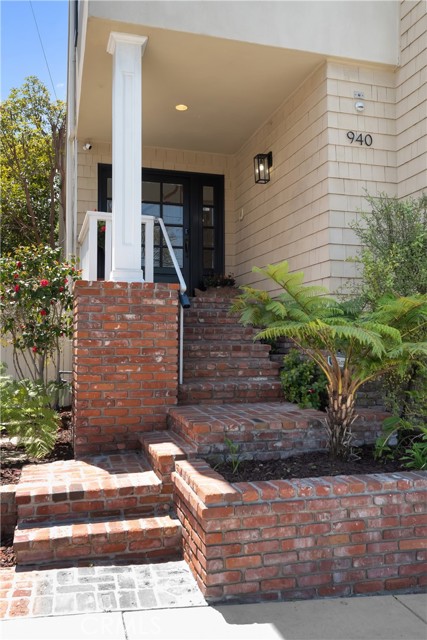 Front brick stairs leading to entry door